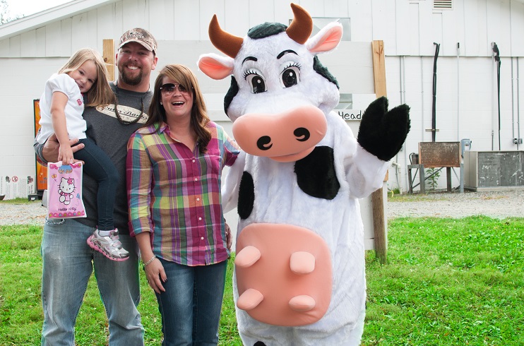 Family with Homeland Creamery cow